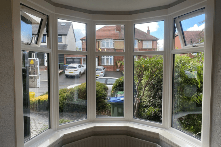Newly installed white uPVC casement bay windows inside a Bearwood home.