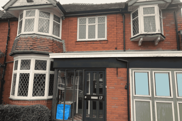 Old timber bay windows with leaded glass in a Bearwood property before replacement.
