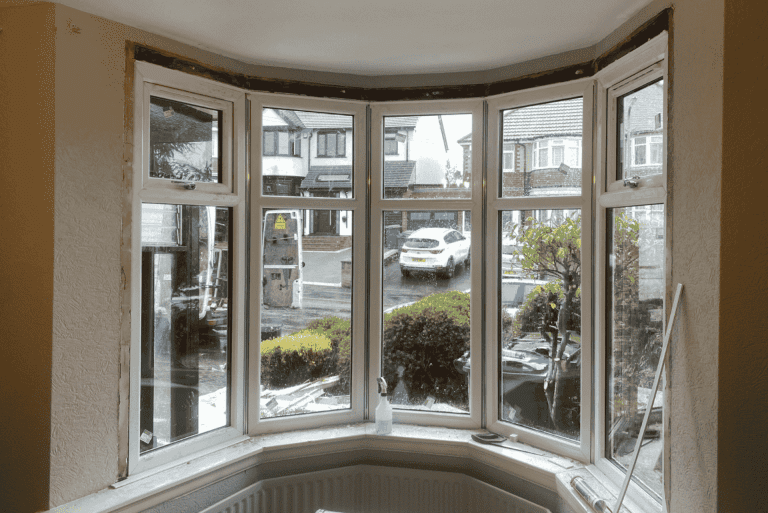Casement window installation in progress at a Bearwood home, showing removal of old timber frames.