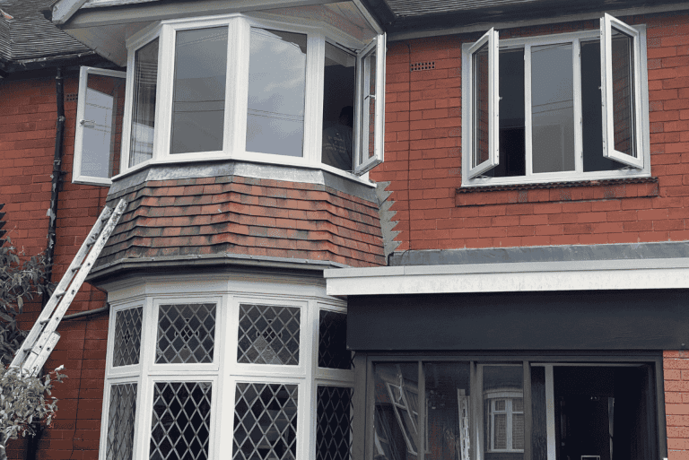 New uPVC casement windows being fitted to upstairs bay at a Bearwood property.